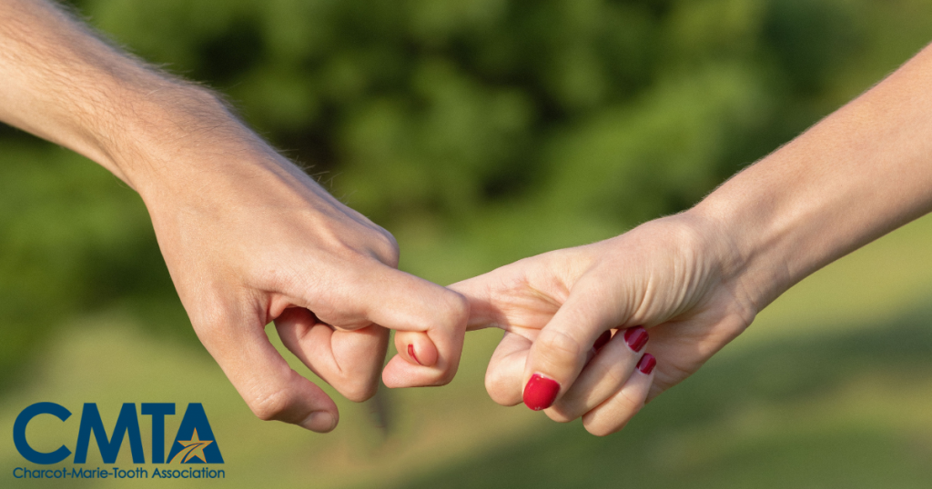 Two hands - holding fingers in support. 